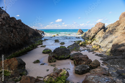 Remote cove with several rocks and the ocean in the background © Alberto