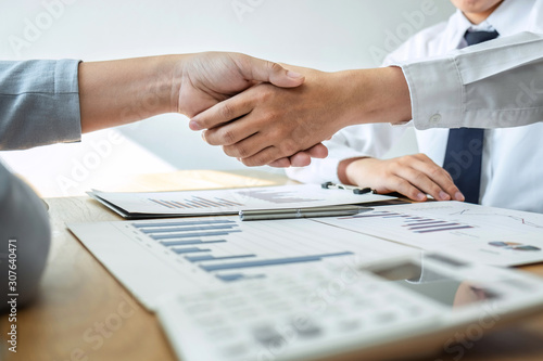 Businessman shaking hands after conversation, Finishing up a collaboration discussing of partner cooperation in investment marketing project and successful contract agreement to become teamwork