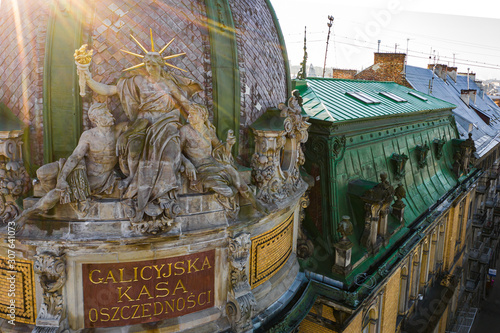 Aerial view on ETNOGRAPHY MUSEUM (FORMER GALICIAN SAVING'S BANK BUILDING). Sitting statue of liberty photo