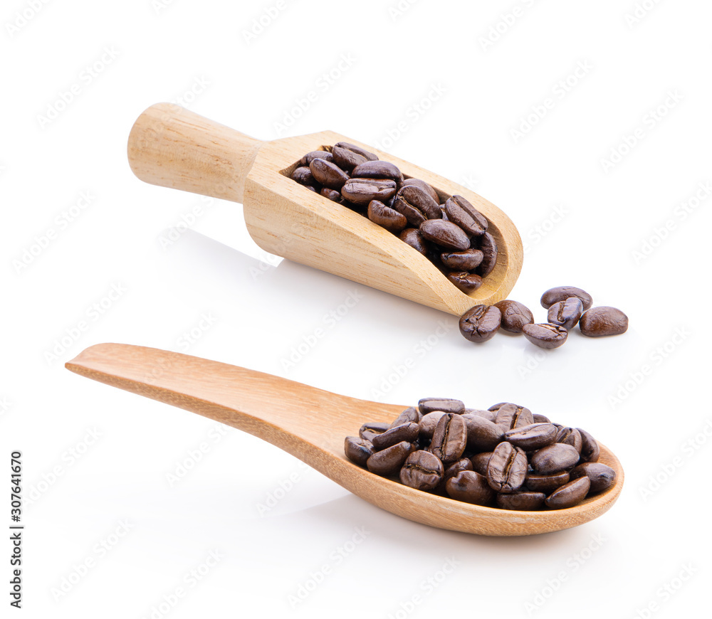 roasted coffee beans in wood spoon and scoop isolated on white roasted coffee beans in wood spoon and scoop isolated on white