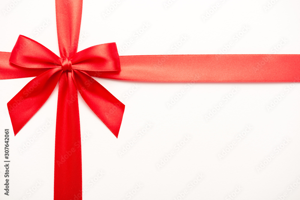 top view of ribbon with red satin bow isolated on white top view of ribbon with red satin bow isolated on white
