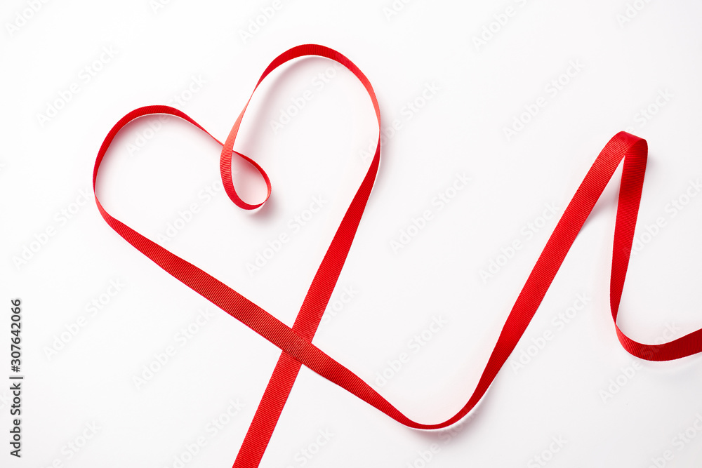top view of red decorative heart-shaped ribbon on white