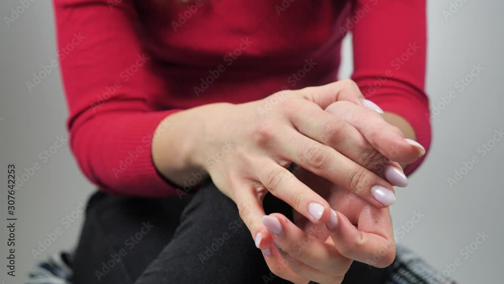 Close-up of wringing nervous woman hands in red sweatshirt 4k Close-up of wringing nervous woman hands in red sweatshirt 4k