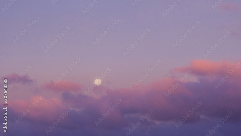 Purple sunset sky with full moon. Nature background