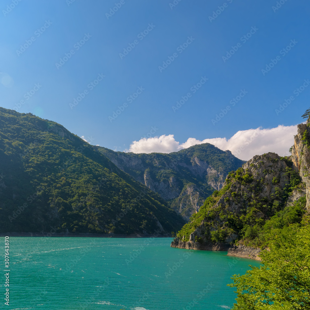 Aerial photo of Piva Lake in Montenegro. Road above Piva Lake (Pivsko Jezero). Montenegro, Pluzine, Lake of Piva, Mratinje Dam.