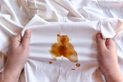 Dirty sauce stain on fabric from accident in daily life. Concept of cleaning stains on clothes or cleaning the house. Selected focus