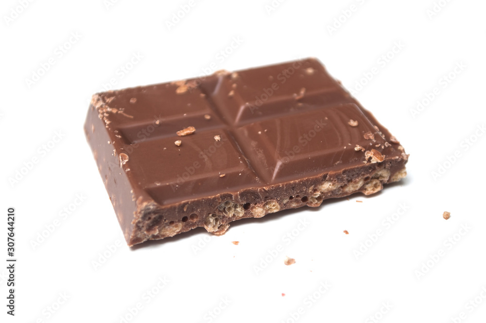 closeup of milk puffed rice chocolate blocks on white background closeup of milk puffed rice chocolate blocks on white background