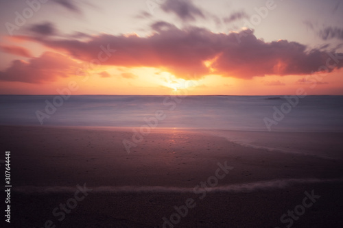 Sunset over the ocean. Panorama of ocean waves and setting sun. Florida, USA © Nickolay Khoroshkov