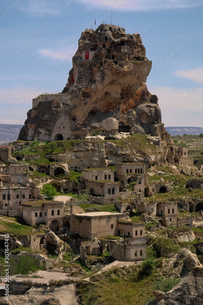 Thanks to the soft and easy shaping of the stones in the Cappadocia region, people built their own living spaces.Its places name Ortahisar Castle,in Turkey.