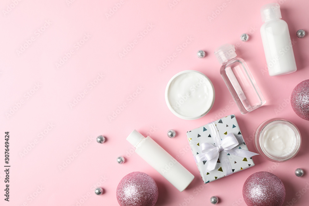 Set cosmetics, jar of winter cream for skin on pink background, space for text. Top view