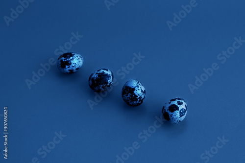 Quail eggs on a blue background Classic blue color 