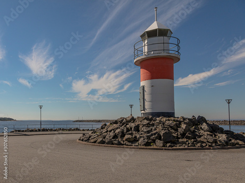 Beautiful seascape with lighthouse and windmills. Gulf of Bothnia overlooking the lighthouse.