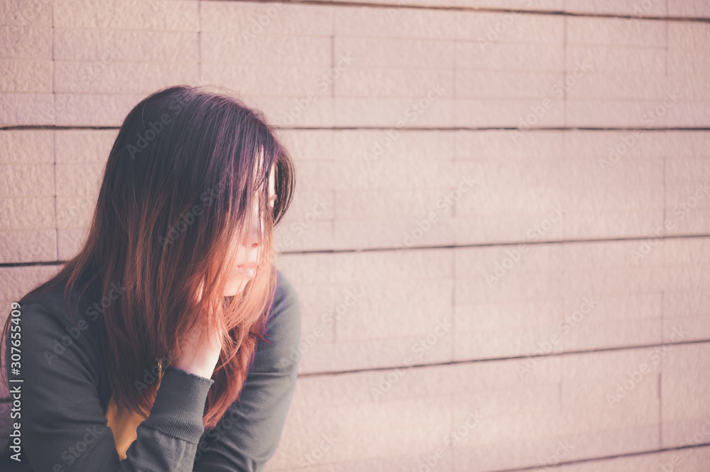 Asian woman sitting alone and depressed,Portrait of tired young woman, Depression Asian woman sitting alone and depressed,Portrait of tired young woman, Depression