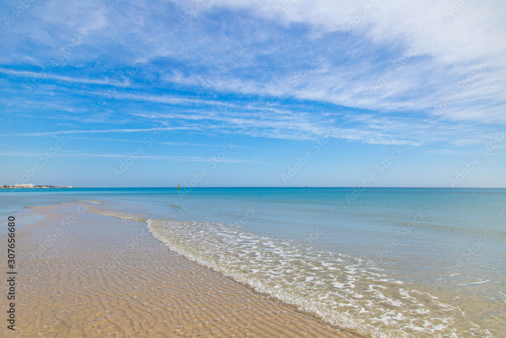 Beautiful sea landscape. Blue sea water and clear peaceful sky. Horizontal color photography.