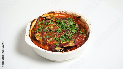 Eggplant with ground beef in tomato sauce in the oven