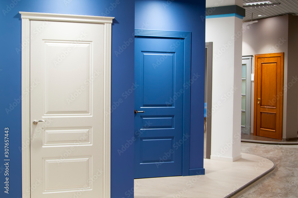 concept of the unknown hidden behind doors, when given a choice at the fork of life. example of interior doors at the exhibition store concept of the unknown hidden behind doors, when given a choice at the fork of life. example of interior doors at the exhibition store