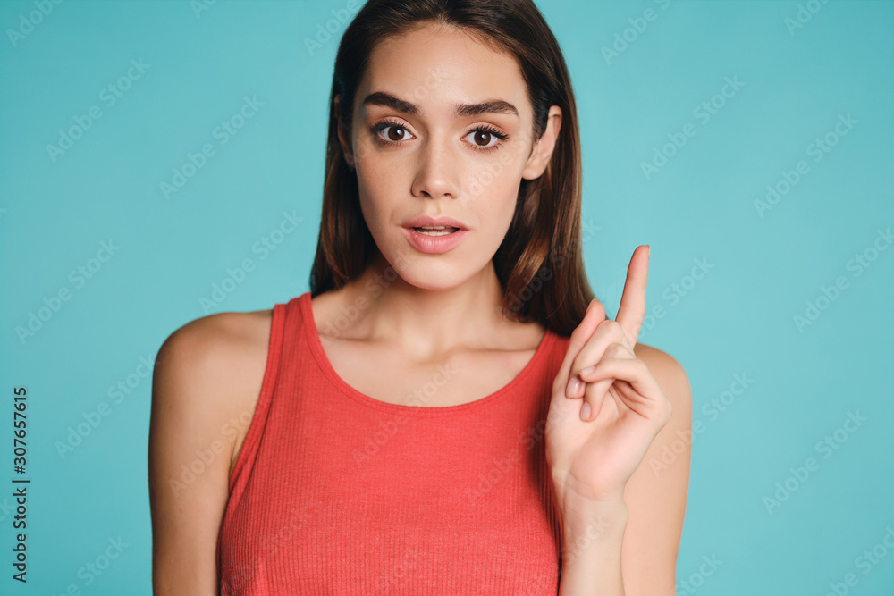 Portrait of beautiful casual girl having idea thoughtfully looking in camera over colorful background isolated Portrait of beautiful casual girl having idea thoughtfully looking in camera over colorful background isolated
