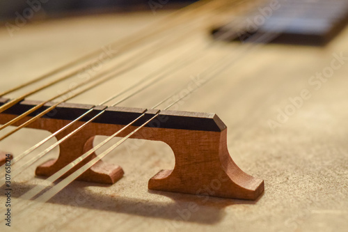 Beautiful macro shot of an instrument bridge and strings