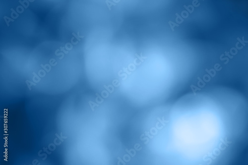 Unfocused classical blue bokeh light background. Color tone of 2020