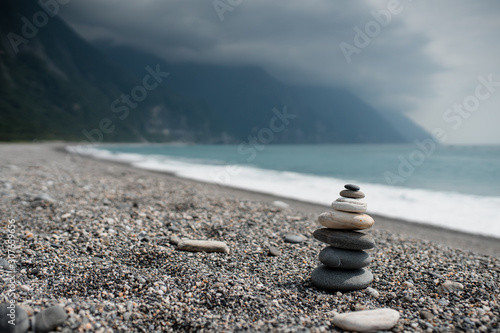 stack of stones on the blue beach