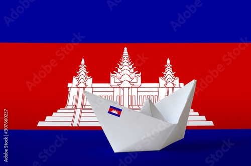 Cambodia flag depicted on paper origami ship closeup. Handmade arts concept photo