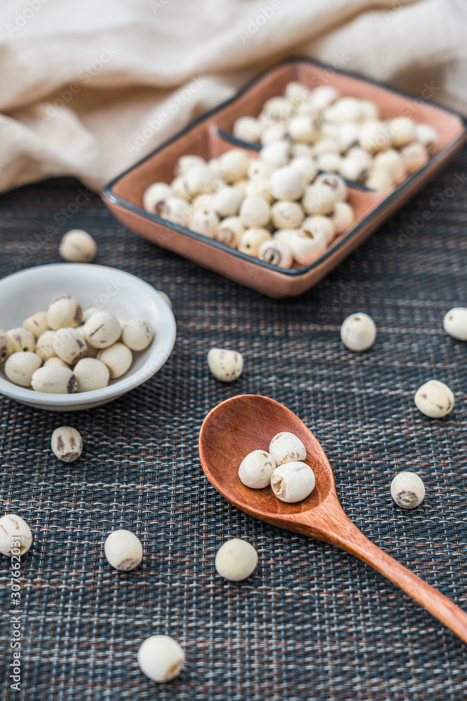 Low angle shot of many lotus seeds on a plate Low angle shot of many lotus seeds on a plate