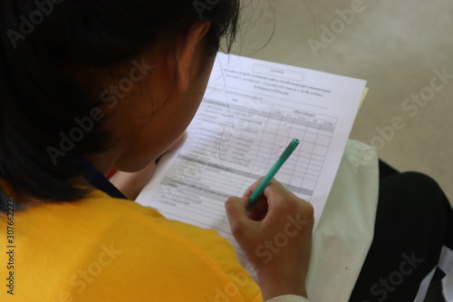Girl filling out a questionnaire.