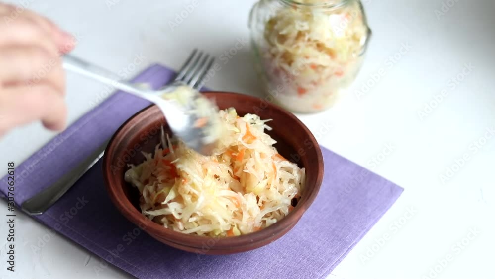 Fermented cabbage salad with red onion. Pour with vegetable oil. Healthy eating Vegetarian dish. Fermented cabbage salad with red onion. Pour with vegetable oil. Healthy eating Vegetarian dish.