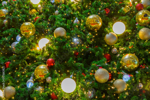 Horizontal image close up and selective focus red wrinkle Cristmas ball hanging on Cristmas tree for celebrate