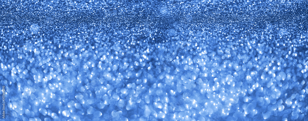 Obraz premium Holiday abstract texture. Christmas card with copy space. ?lassic blue background bokeh, defocused lights.
