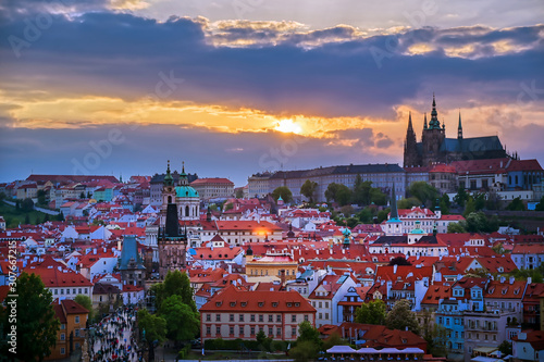 Photography A view of Prague Castle and the Charles Bridge across the Vltava River in Prague, Czech Republic
