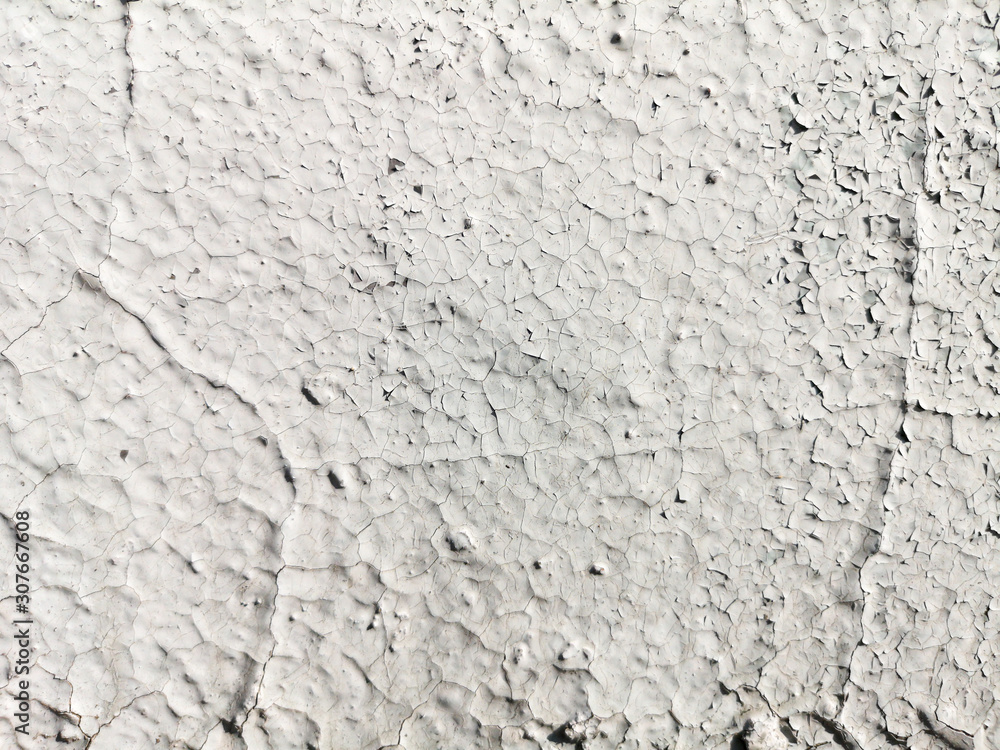 Stucco cracked on the wall as abstract background Stucco cracked on the wall as abstract background