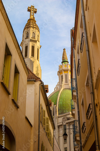 A low angle shot of a dome and a bell tower of the Art Deco style Church Saint-Blaise. Vichy, France. (ID: 307669643)