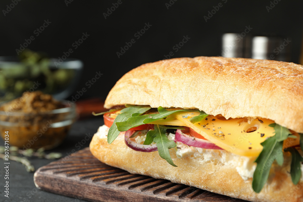 Delicious sandwich with fresh vegetables and cheese on grey table, closeup Delicious sandwich with fresh vegetables and cheese on grey table, closeup