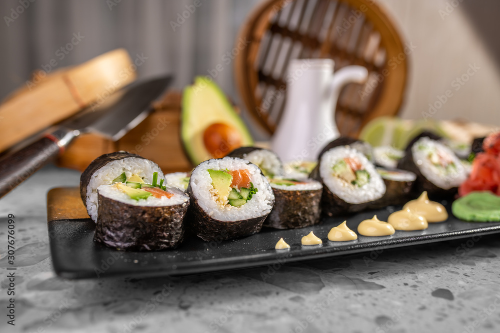 Sushi set with maki roll, fresh salmon and tuna nigiri Sushi set with maki roll, fresh salmon and tuna nigiri