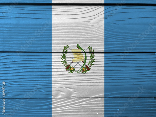 Guatemala flag color painted on Fiber cement sheet wall background, blue and white color with the national Emblem centered.
