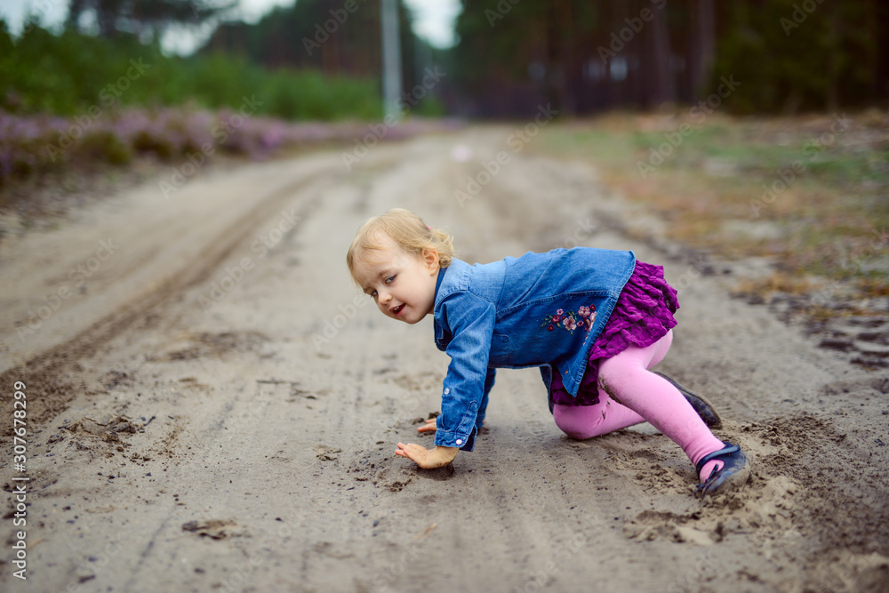 Adorable girl having fun on beautiful autumn day. Authentic picture Adorable girl having fun on beautiful autumn day. Authentic picture