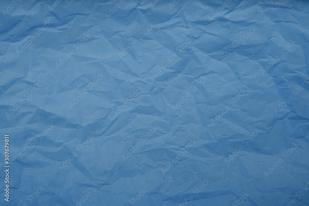 Obraz premium Pale blue crumpled paper texture background. Abstract pattern