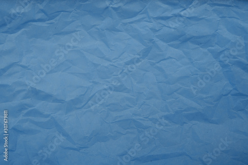 Pale blue crumpled paper texture background. Abstract pattern