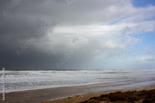 agitated ocean under a tormented sky