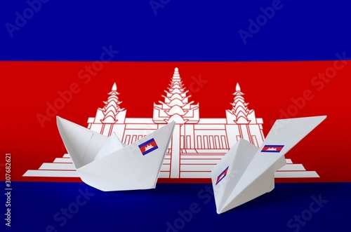 Cambodia flag depicted on paper origami airplane and boat. Handmade arts concept photo