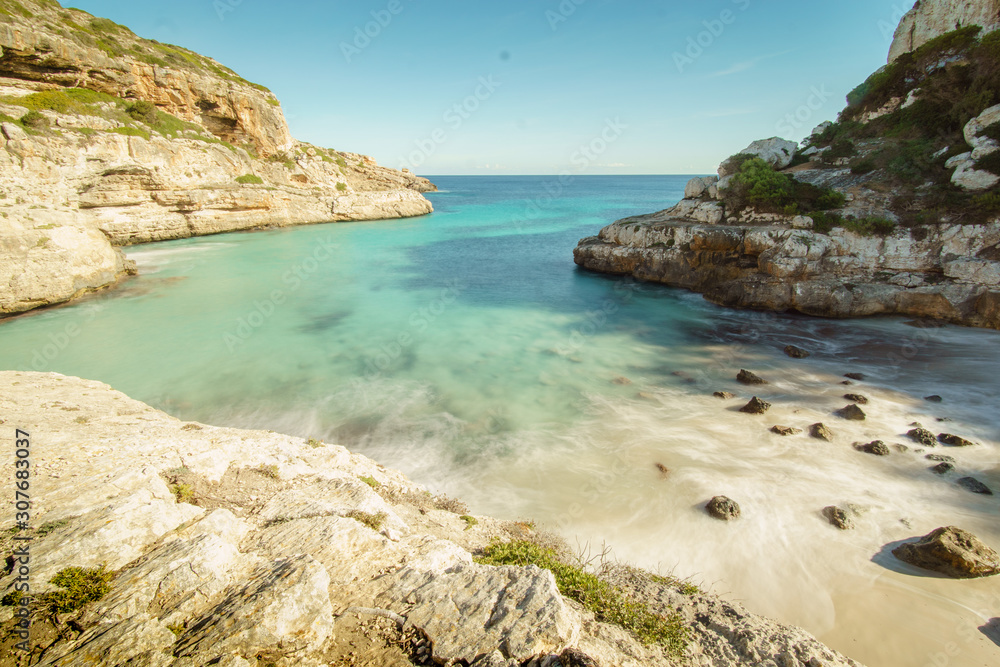 Picturesque beach lovely cove of sand, stone and rocks on Mallorca Island, Baleares, Spain Picturesque beach lovely cove of sand, stone and rocks on Mallorca Island, Baleares, Spain