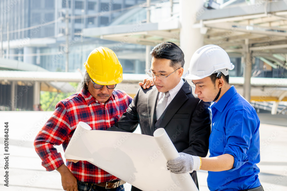 Businessman or boss manager in suit meeting with engineer outdoor Businessman or boss manager in suit meeting with engineer outdoor