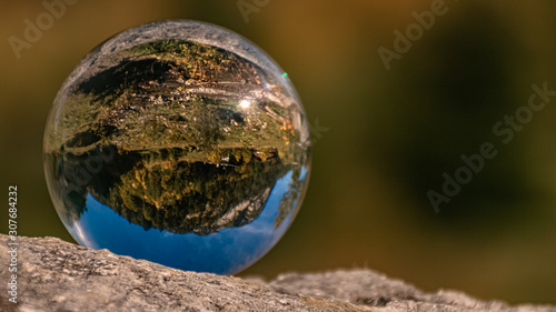 Crystal ball alpine landscape shot at the famous Big Maple Ground, Tyrol, Austria