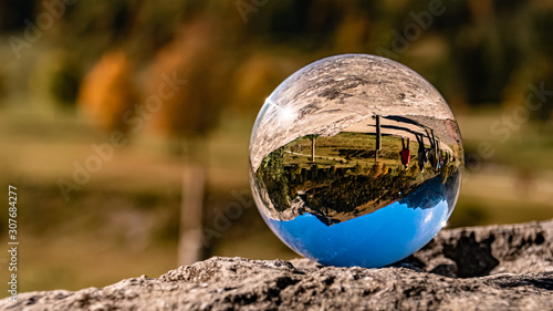 Crystal ball alpine landscape shot at the famous Big Maple Ground, Tyrol, Austria