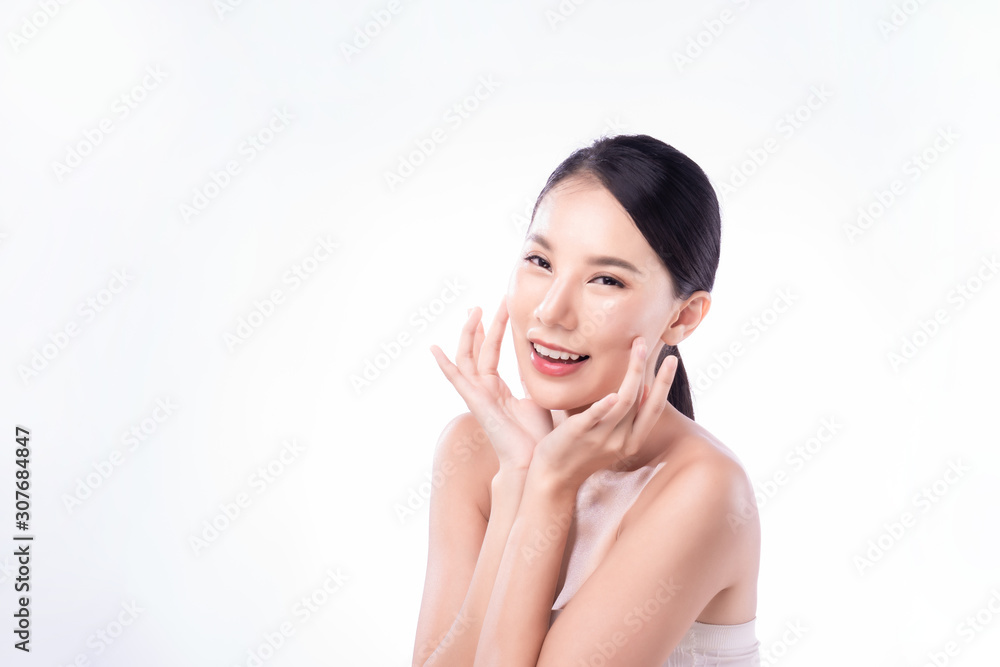 Beautiful Young Asian woman with clean fresh white skin touching own face softly in beauty pose. Girl touching with finger in isolated background. Facial treatment, cosmetology, spa, make up concept. Beautiful Young Asian woman with clean fresh white skin touching own face softly in beauty pose. Girl touching with finger in isolated background. Facial treatment, cosmetology, spa, make up concept.