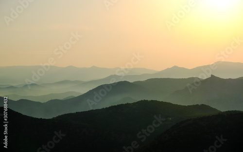 Landscape, sunset in the sky against the mountains, mountain ranges during sunset