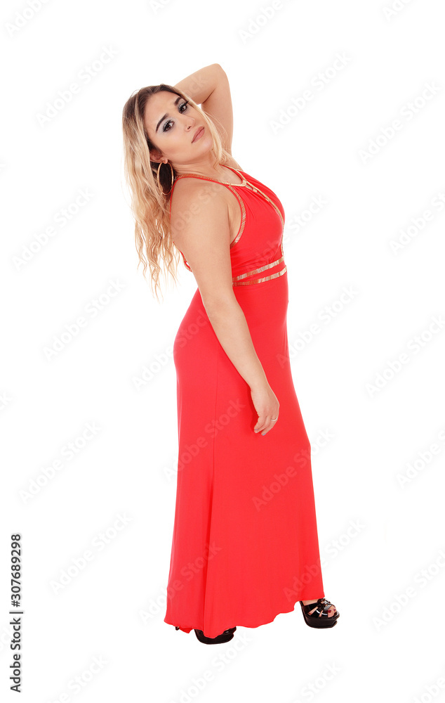 Beautiful blond woman standing in red dress