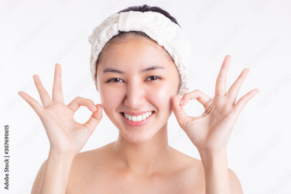 Young asian woman has perfect facial skin. Attractive beautiful customer lady give okay with smile face. Pretty girl get happiness. Glamour woman has smooth skin face, radiant skin. Skin care concept Young asian woman has perfect facial skin. Attractive beautiful customer lady give okay with smile face. Pretty girl get happiness. Glamour woman has smooth skin face, radiant skin. Skin care concept