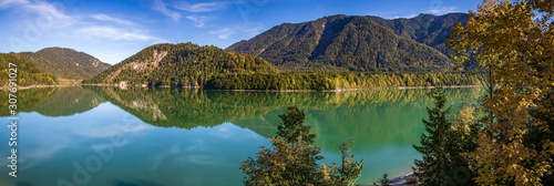 High resolution stitched panorama of a beautiful alpine view with reflections at the famous Sylvenstein lake  Bavaria  Germany